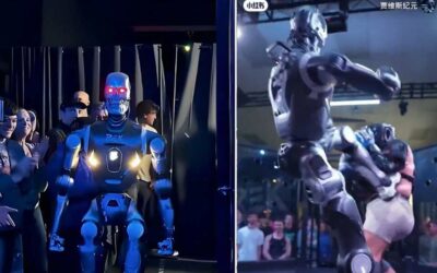 Ķīniešu humanoīds robots T800 uzņem cilvēku pirmajā savā veida cīņā būros, nosūta viņu lidošanai un atstāj viņu ar lauztu roku